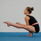 Straddle hold on floor